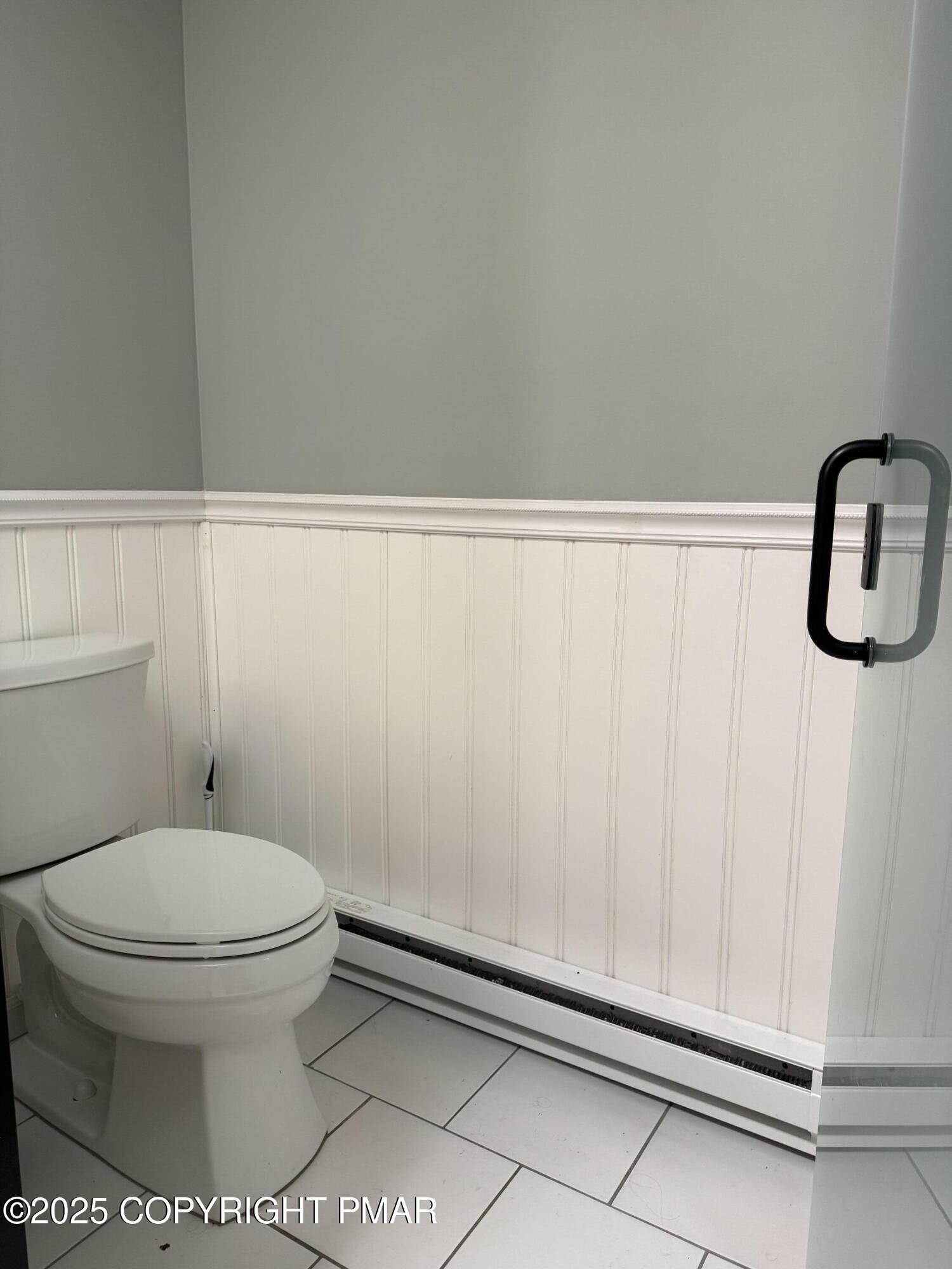 1146 Colt Lane Pocono Summit, PA 18346 - Photo 17 of 18 a bathroom with a toilet and a shower curtain