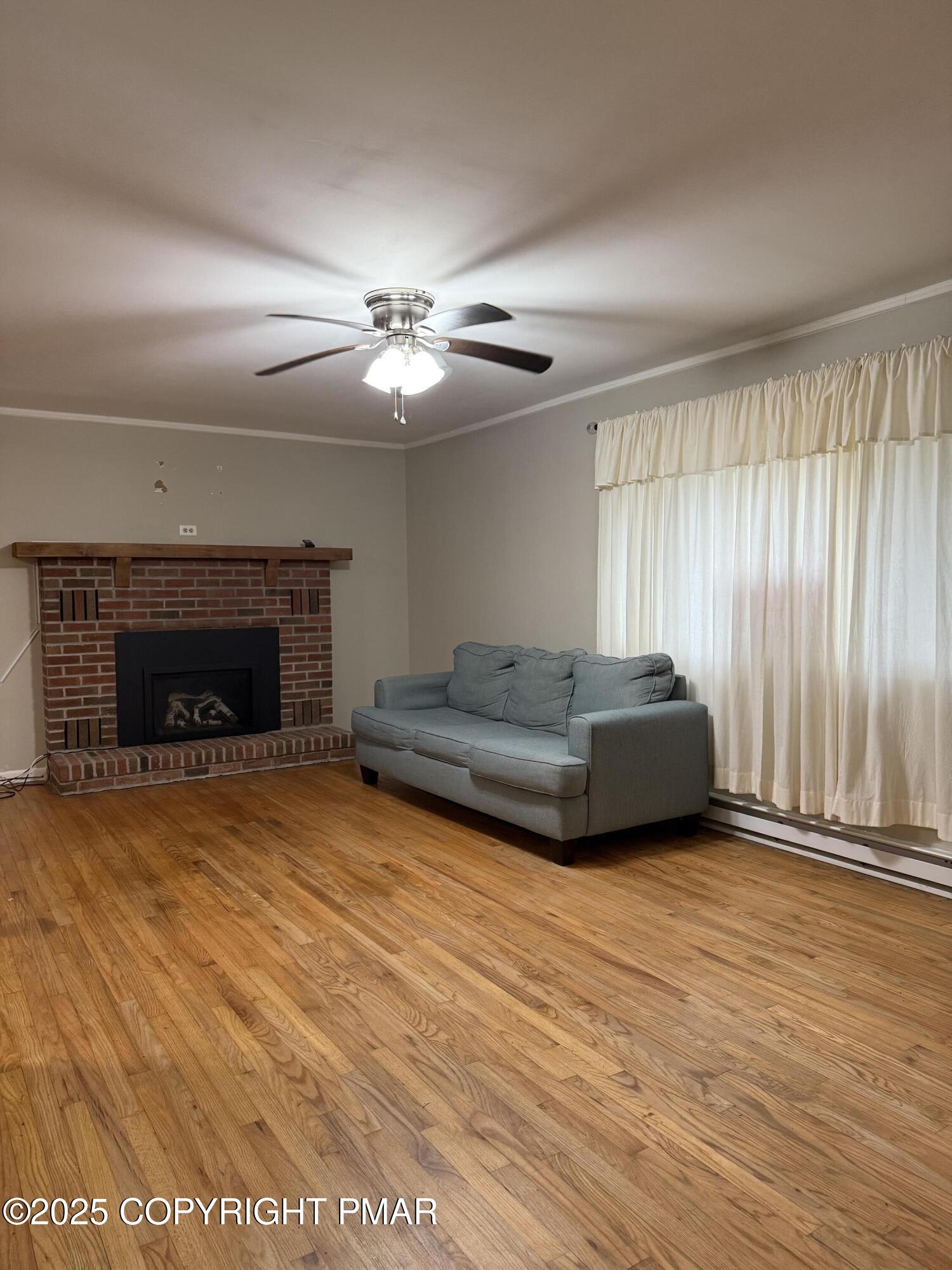 1146 Colt Lane Pocono Summit, PA 18346 - Photo 4 of 18 a living room with furniture and a fireplace