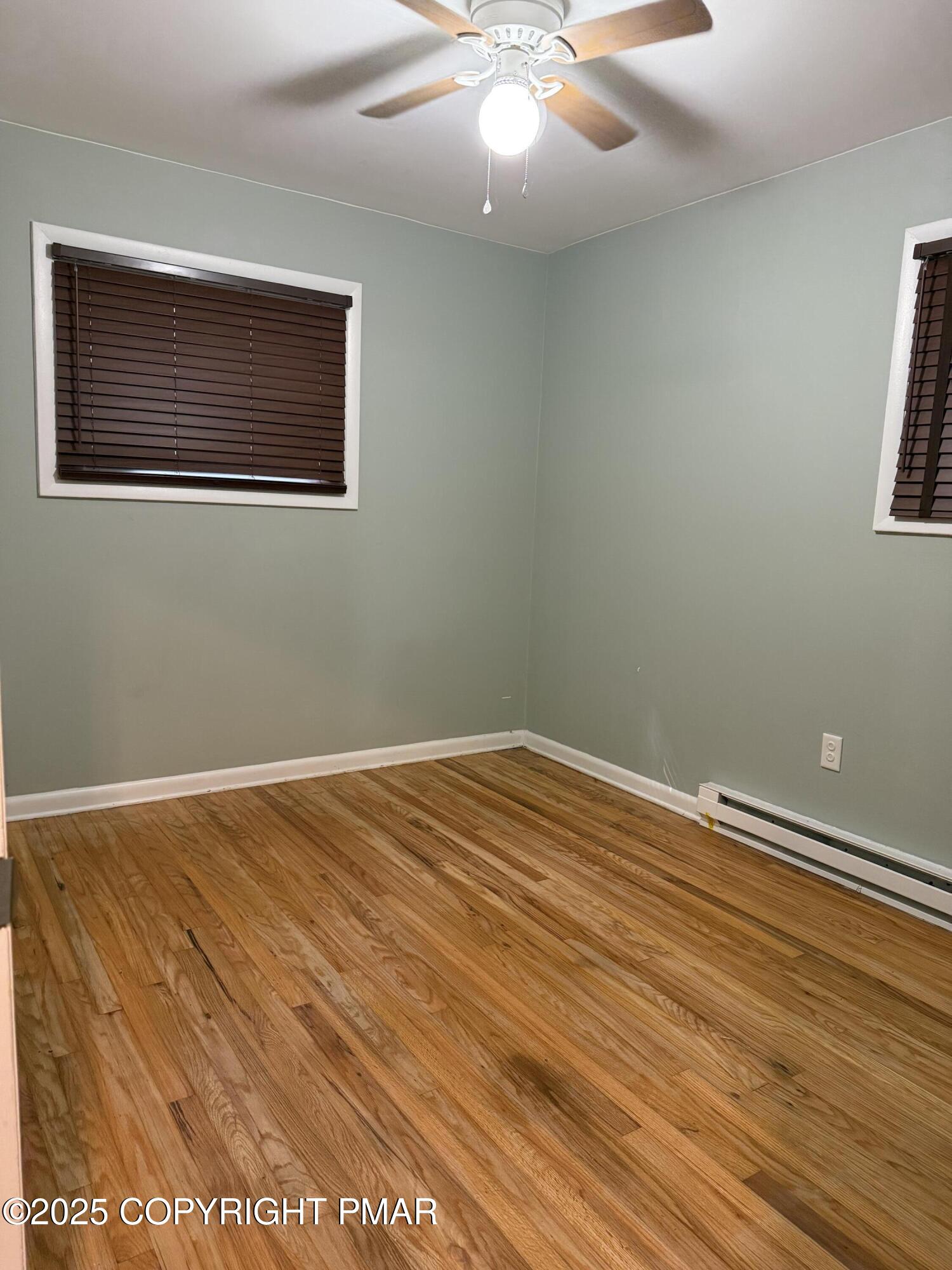 1146 Colt Lane Pocono Summit, PA 18346 - Photo 9 of 18 a view of a room with wooden floor and fan
