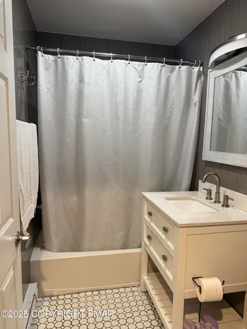 a kitchen with granite countertop cabinets and refrigerator