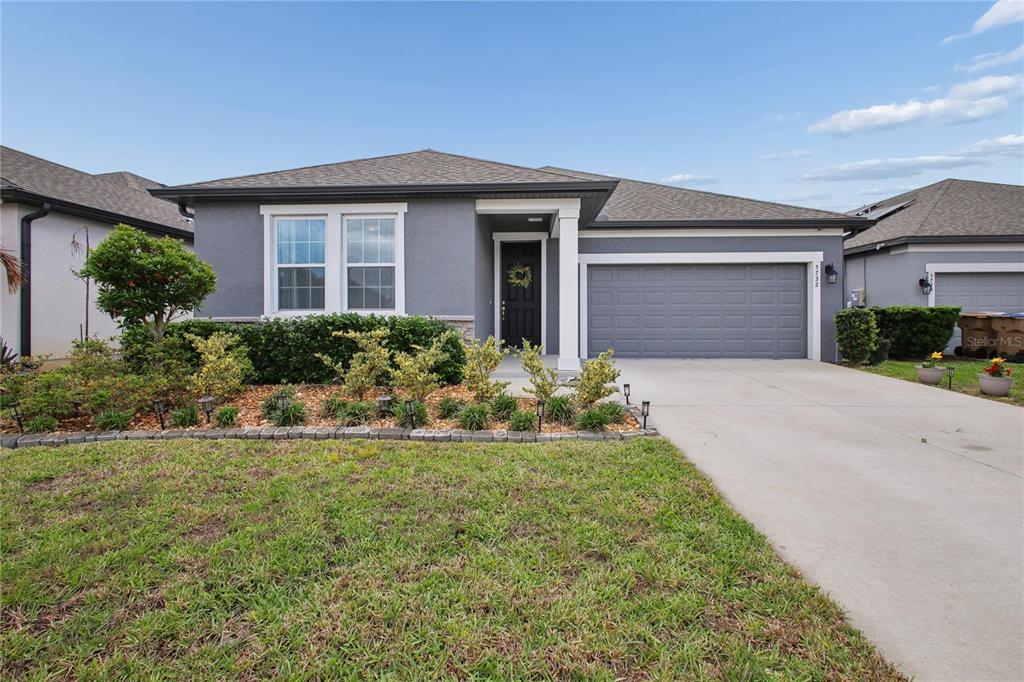 front view of a house with a yard