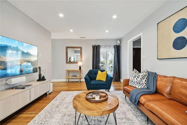 a living room with furniture and a rug