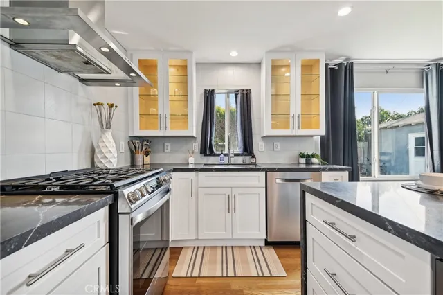 a view of a kitchen with dining table and chairs