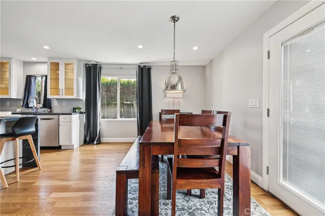 a kitchen with kitchen island a counter top space appliances and a sink