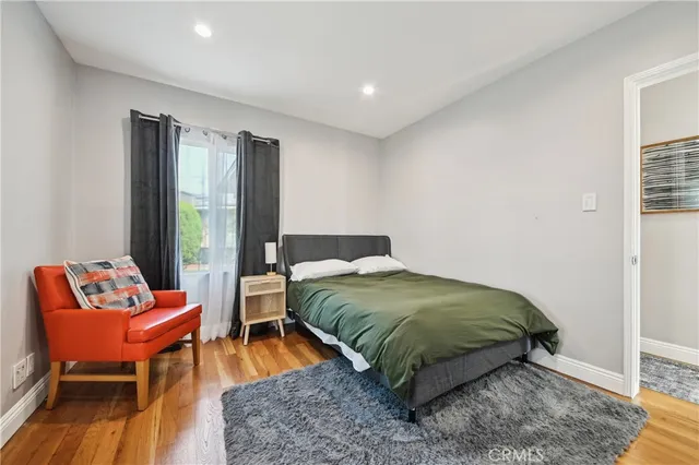 a living room with a bed and furniture