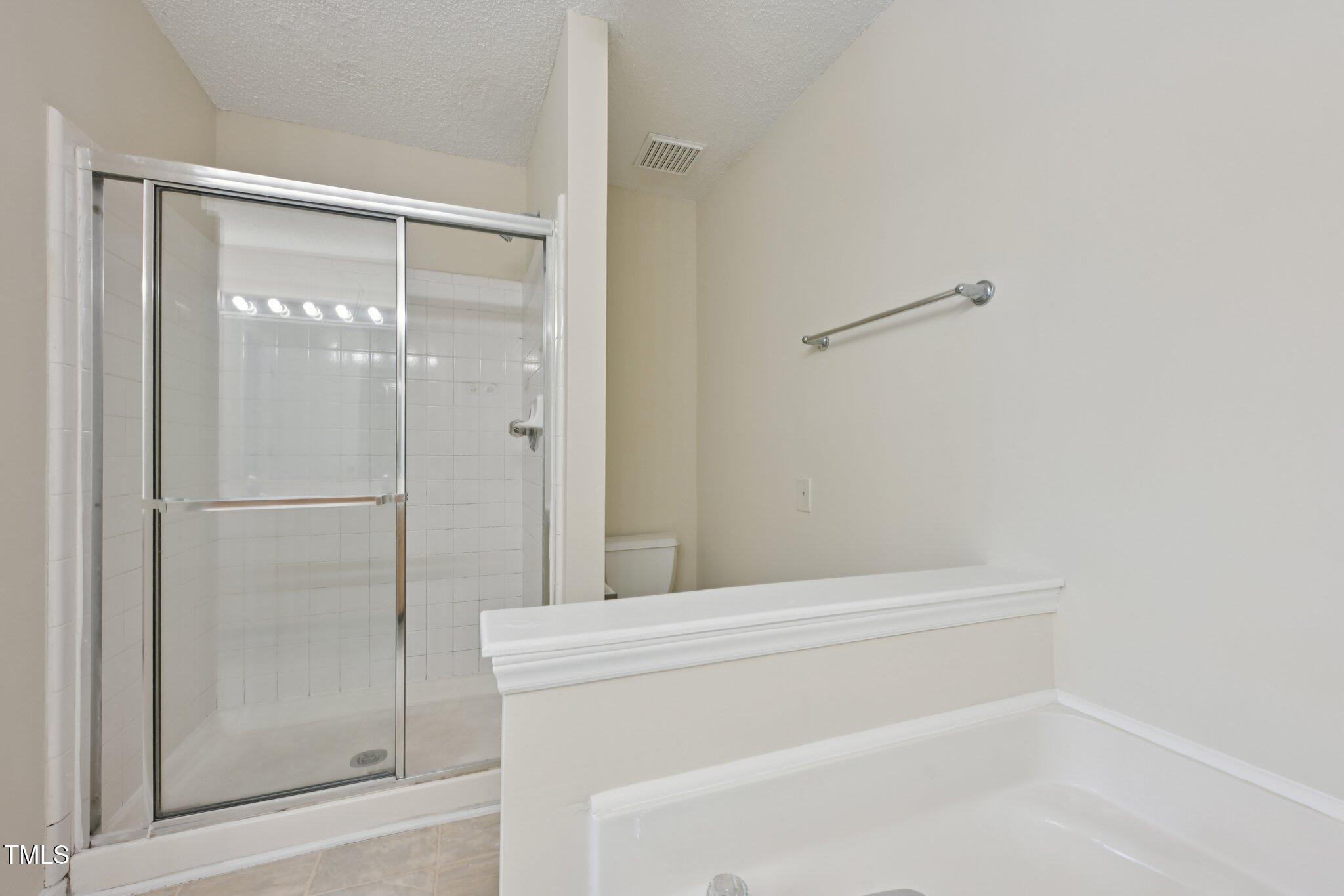 1031 Lake Moraine Place Raleigh, NC 27607 - Photo 22 of 33 a bathroom with a shower