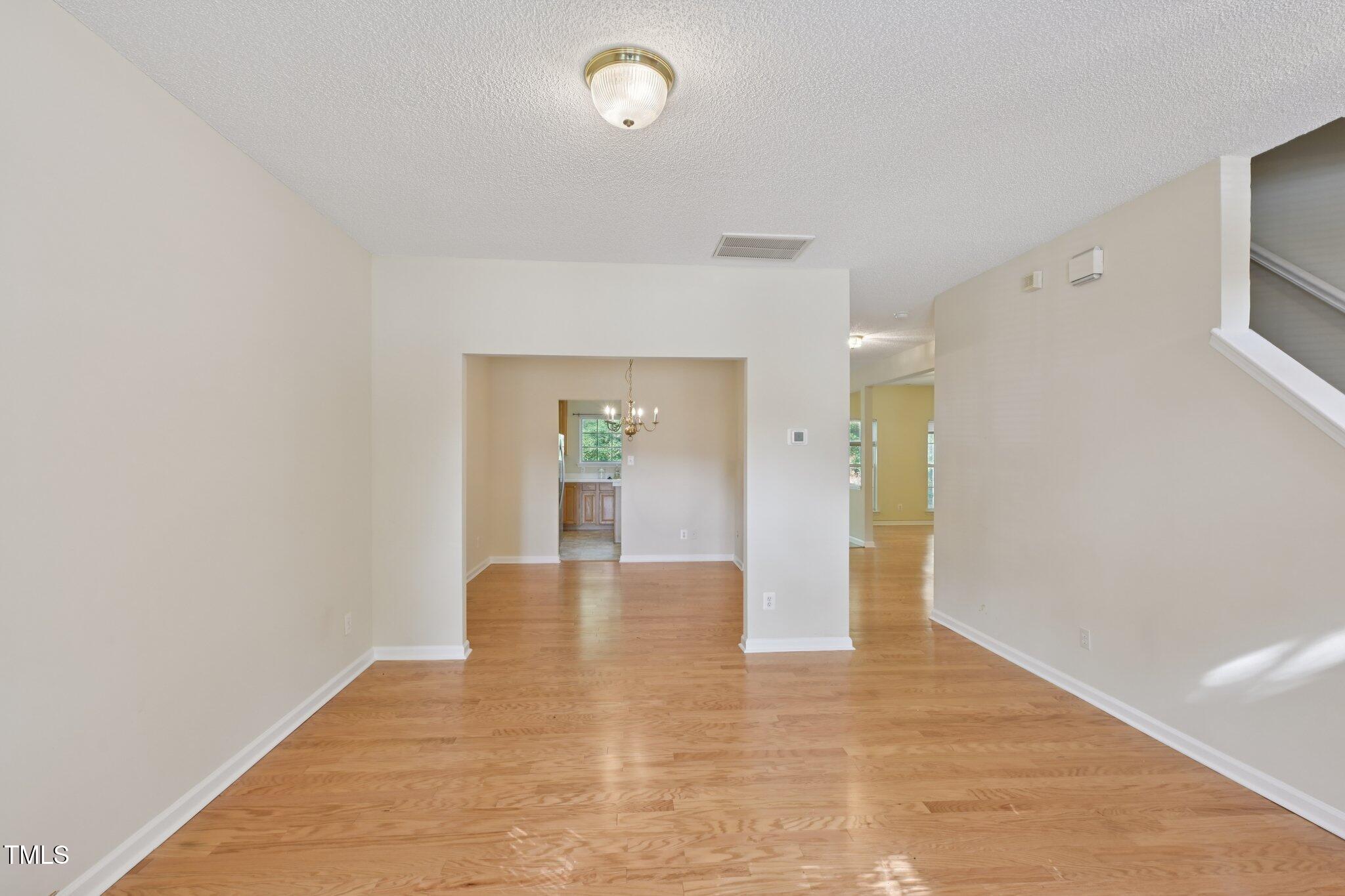 1031 Lake Moraine Place Raleigh, NC 27607 - Photo 5 of 33 a view of livingroom and kitchen