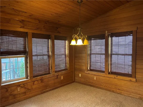 a view of a room with large windows