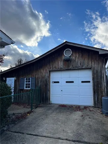 a view of gym with large windows