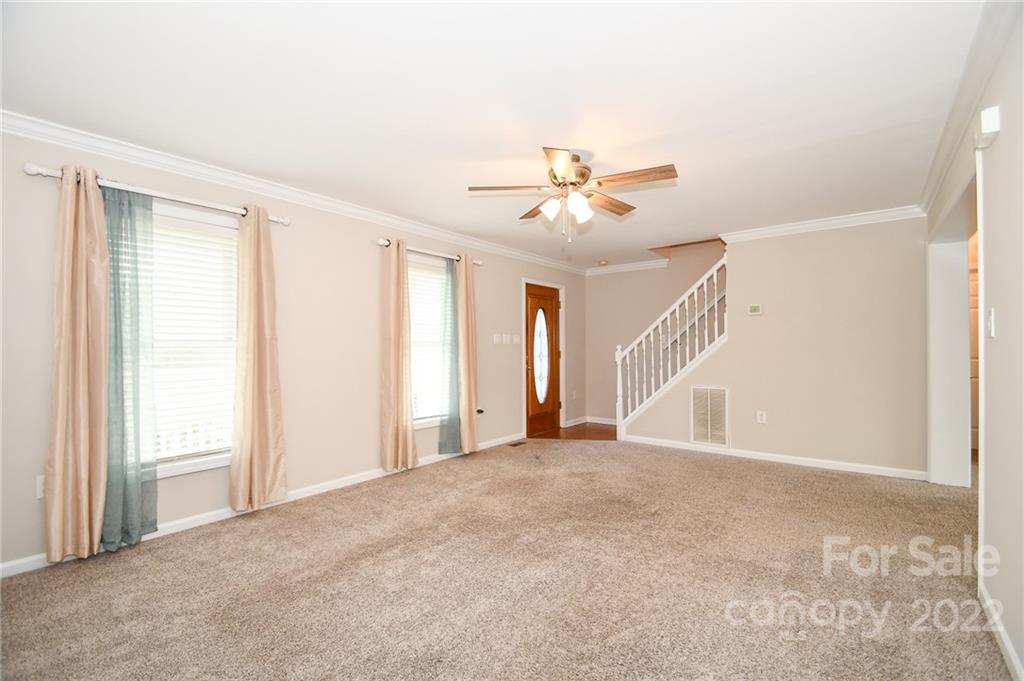 3916 Old Camden Road Monroe, NC 28110 - Photo 6 of 18 a view of an empty room with a window