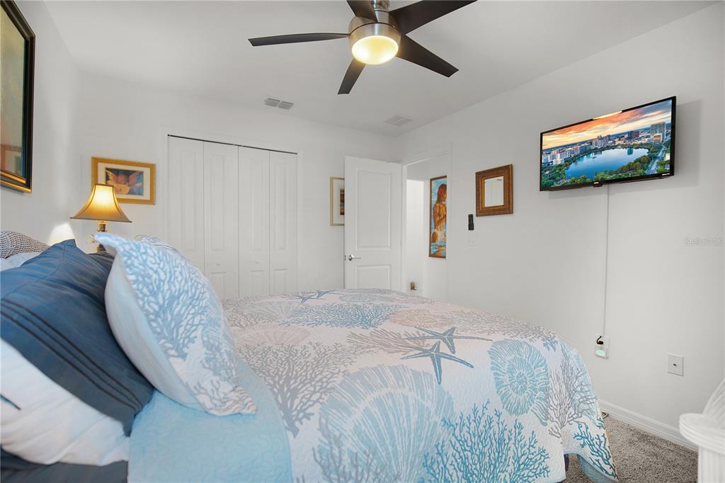 287 Inman Boulevard Winter Haven, FL 33881 - Photo 14 of 19 a bed room with a bed and a chandelier