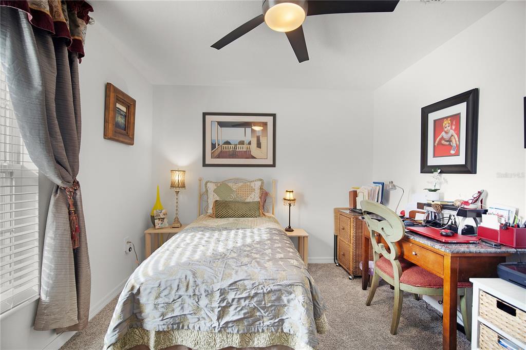 287 Inman Boulevard Winter Haven, FL 33881 - Photo 16 of 19 a bedroom with a bed and a table in it