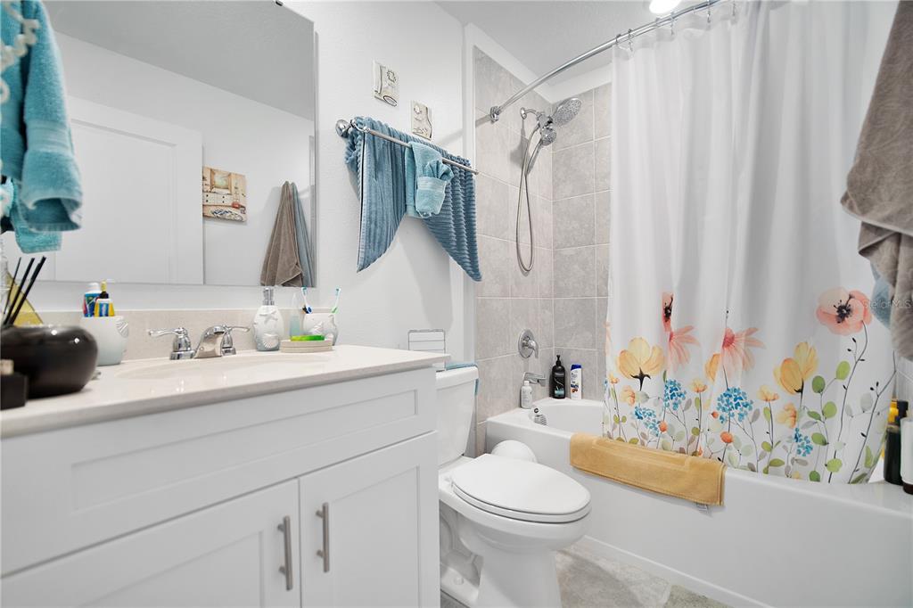 287 Inman Boulevard Winter Haven, FL 33881 - Photo 17 of 19 a bathroom with a sink toilet and shower