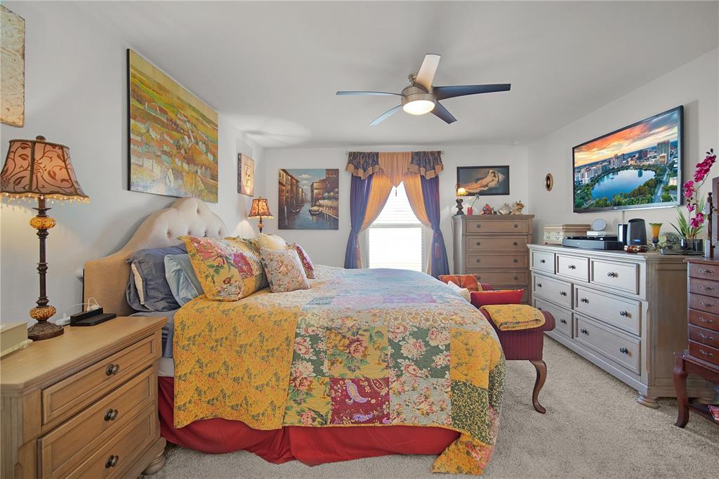 287 Inman Boulevard Winter Haven, FL 33881 - Photo 10 of 19 a bedroom with a bed and a flat screen tv