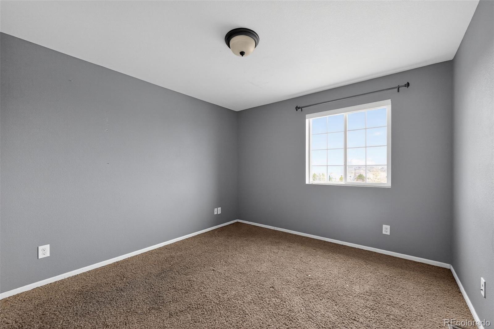 5085 Ridgewood Drive Johnstown, CO 80534 - Photo 13 of 30 a view of an empty room with a window