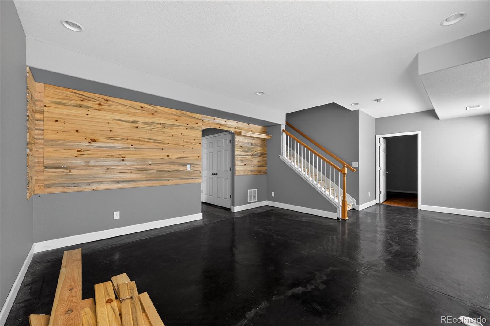 5085 Ridgewood Drive Johnstown, CO 80534 - Photo 21 of 30 a view of an empty room with wooden floor and a window