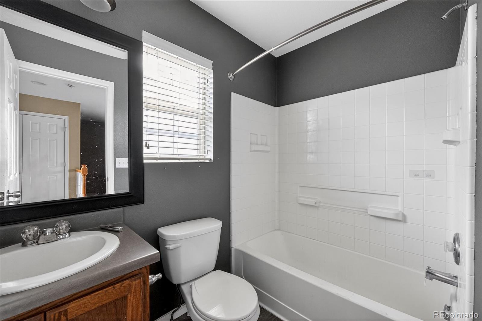 5085 Ridgewood Drive Johnstown, CO 80534 - Photo 24 of 30 a bathroom with a sink toilet and shower