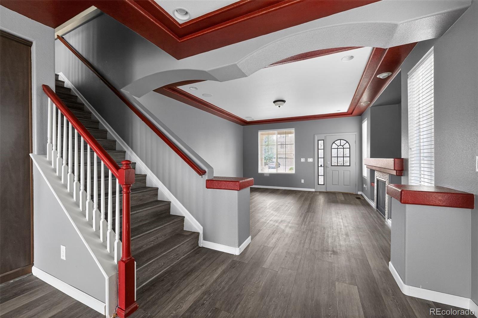 5085 Ridgewood Drive Johnstown, CO 80534 - Photo 8 of 30 a view of entryway and hall with wooden floor
