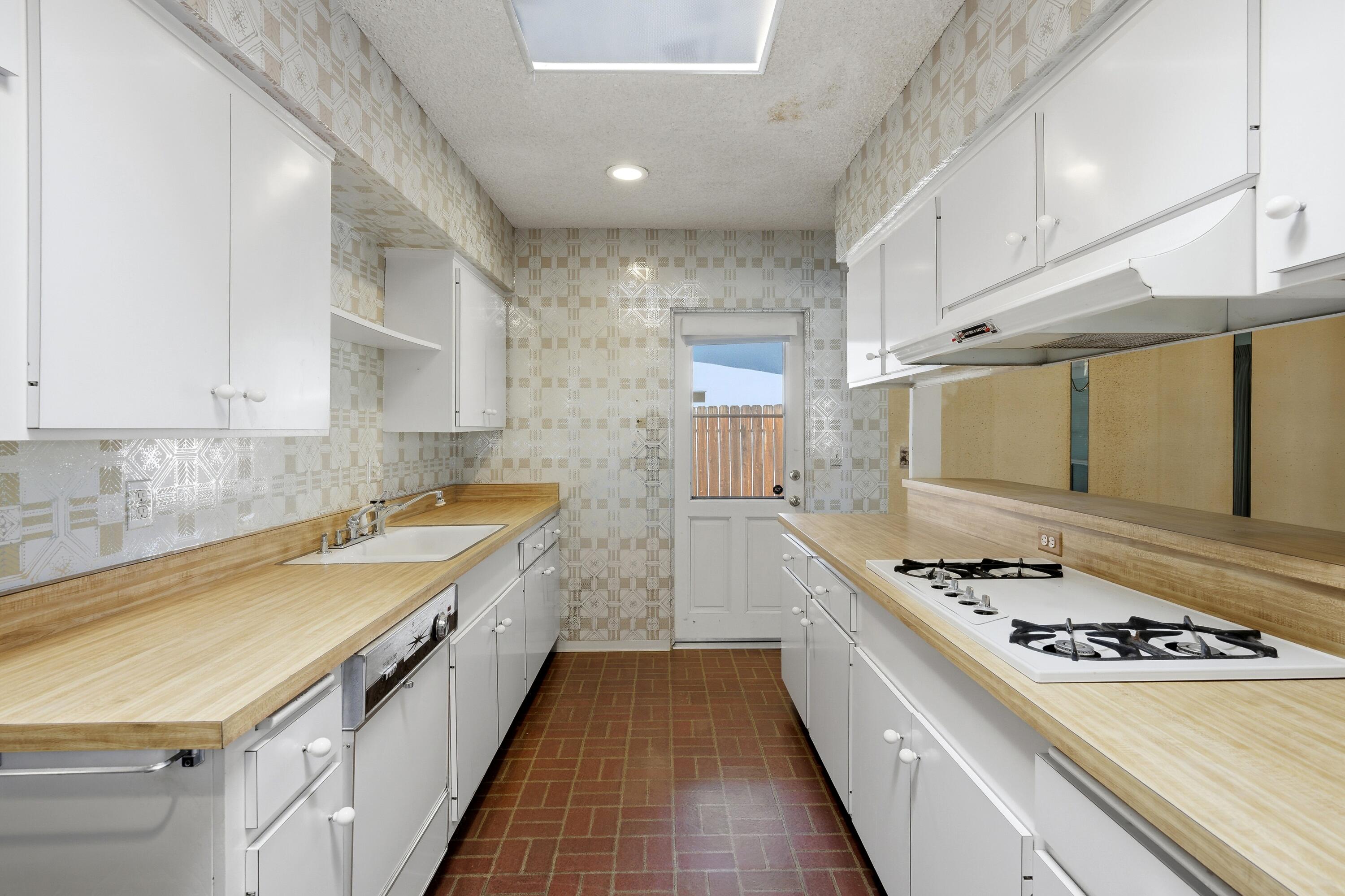 36990 Ferber Drive Rancho Mirage, CA 92270 - Photo 12 of 29 a kitchen with a stove a sink and a stove