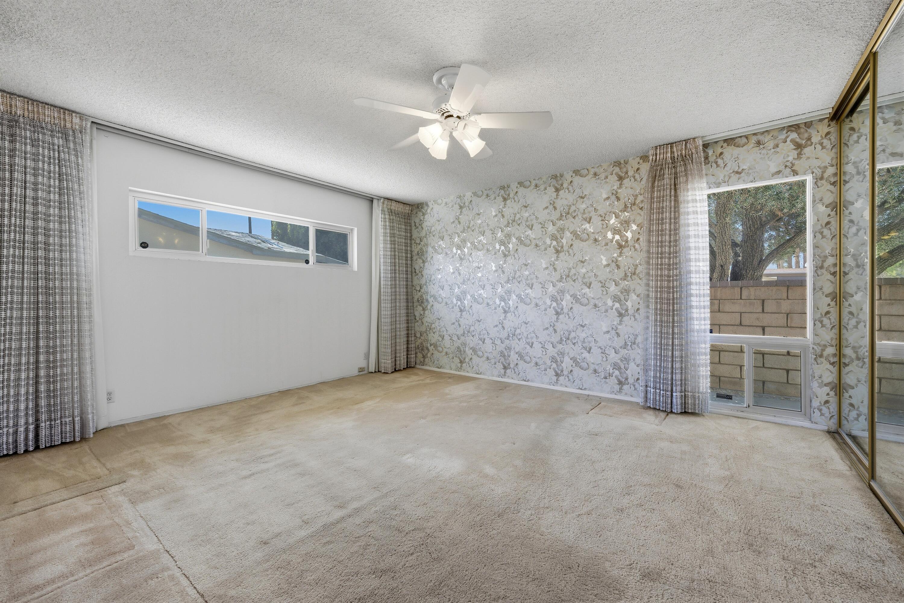 36990 Ferber Drive Rancho Mirage, CA 92270 - Photo 20 of 29 en empty room with windows and ceiling fan