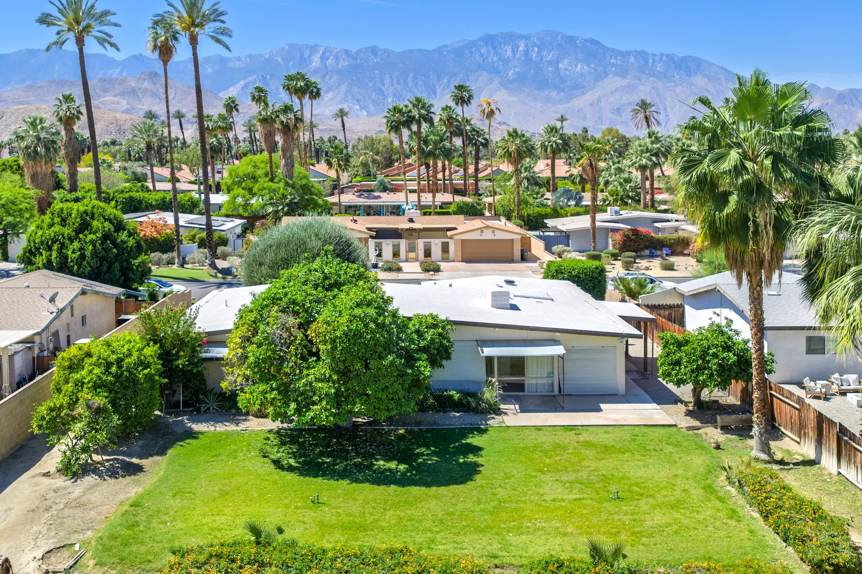 36990 Ferber Drive Rancho Mirage, CA 92270 - Photo 28 of 29 a aerial view of a house with a garden and a building in the background