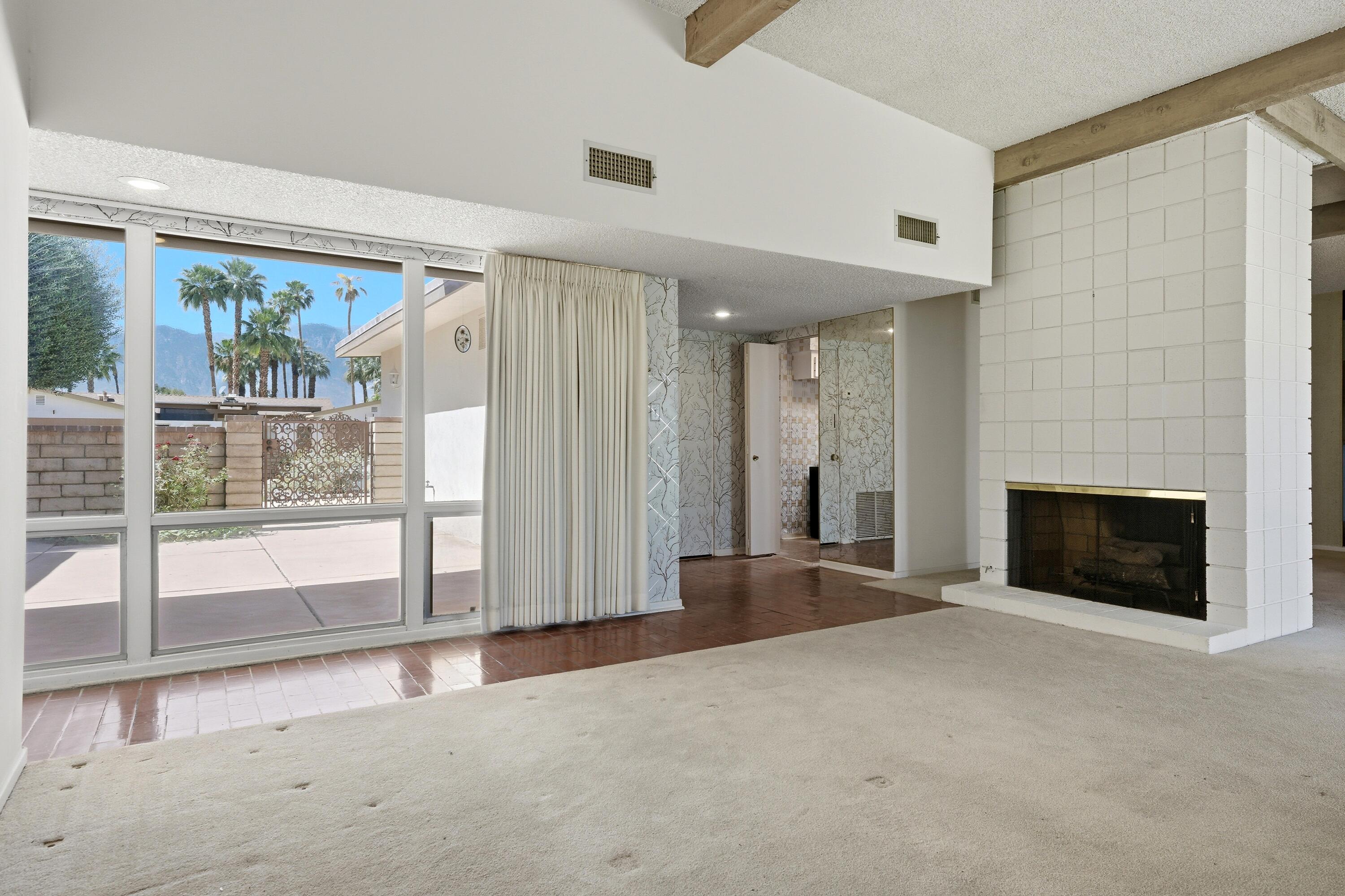 36990 Ferber Drive Rancho Mirage, CA 92270 - Photo 5 of 29 a view of a livingroom with an empty space and a fireplace