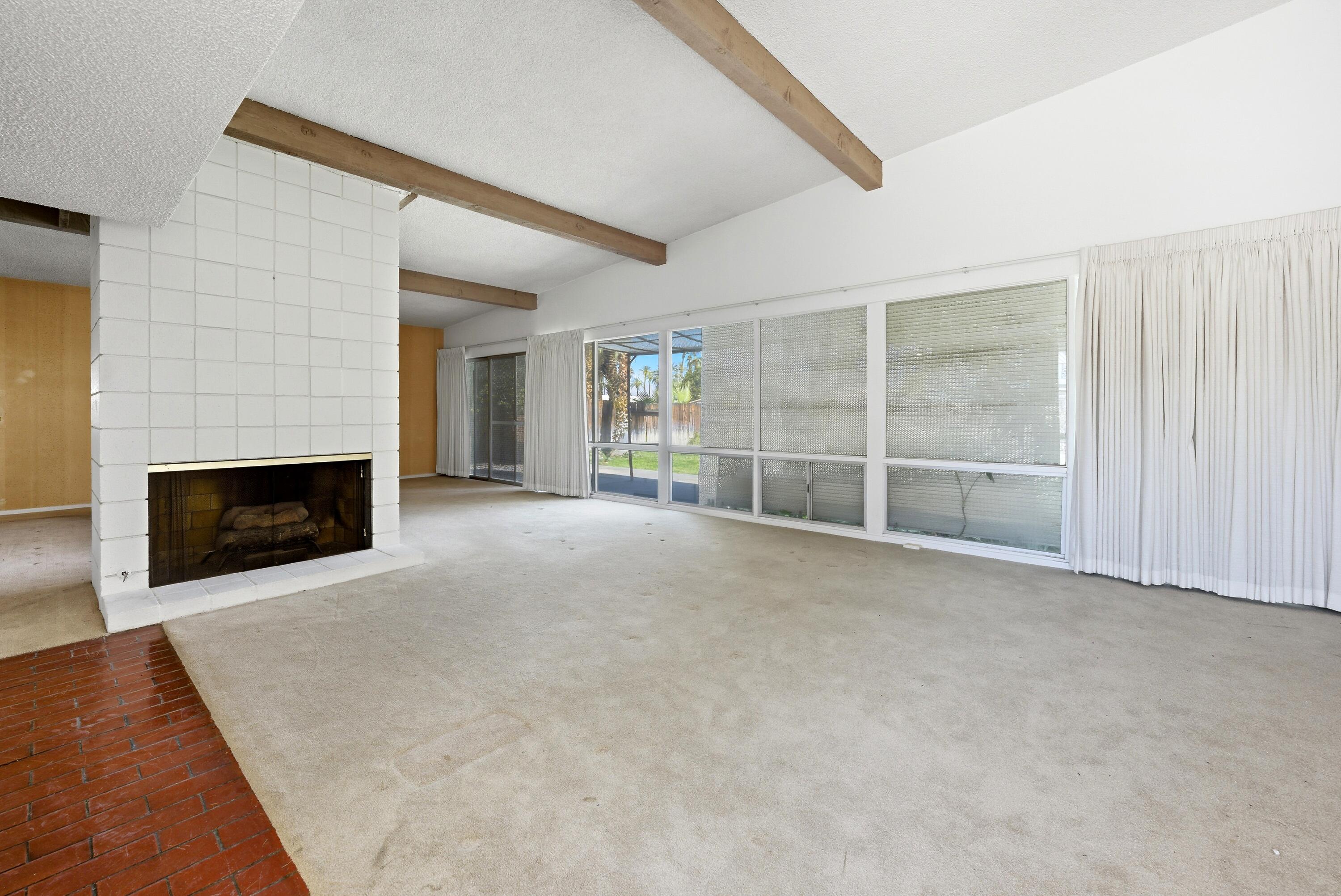 36990 Ferber Drive Rancho Mirage, CA 92270 - Photo 6 of 29 an empty room with a fireplace and window