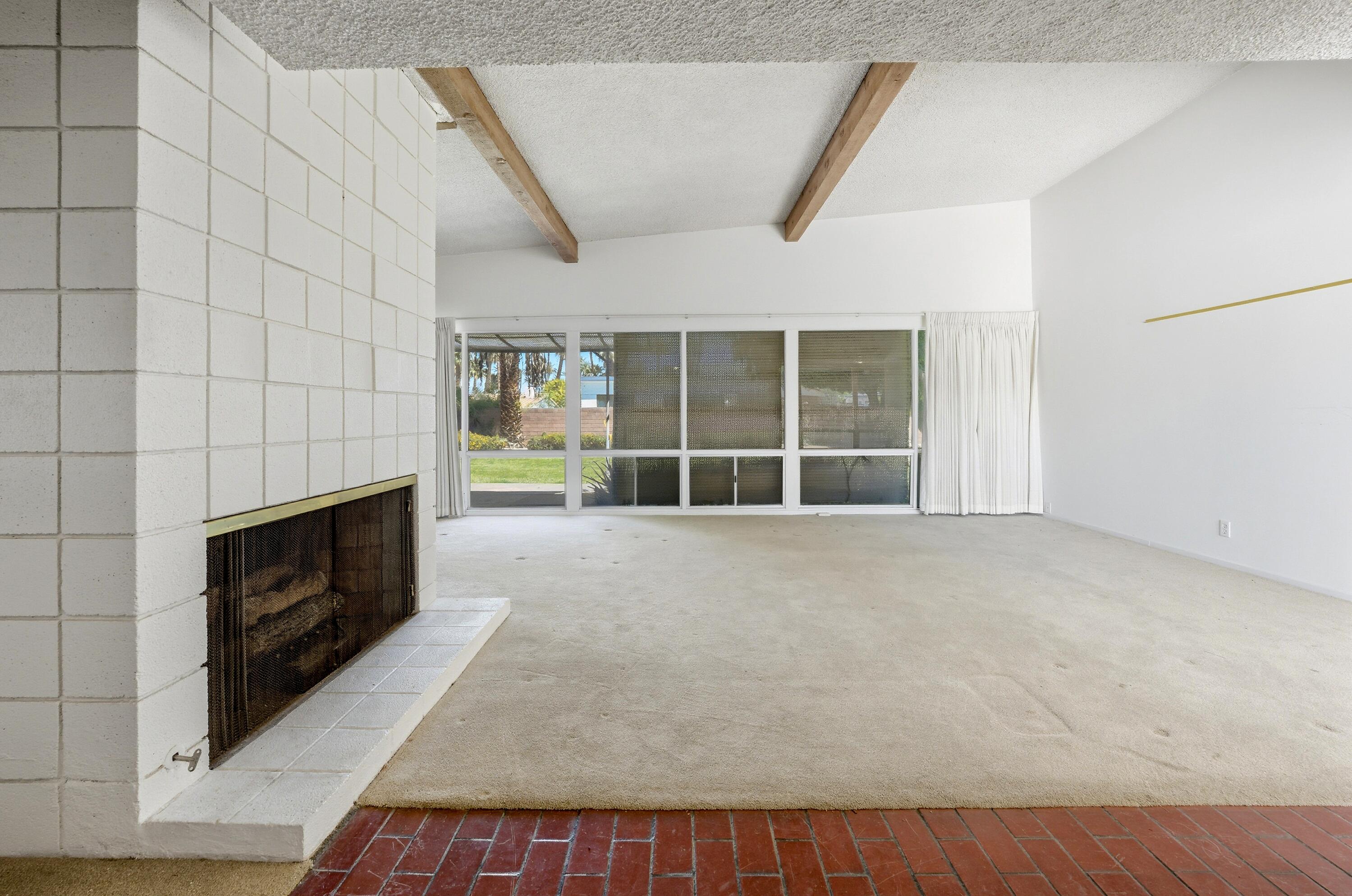 36990 Ferber Drive Rancho Mirage, CA 92270 - Photo 7 of 29 a view of an empty room with a fireplace and a window