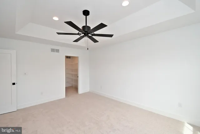 a bathroom with a double vanity sink mirror and toilet