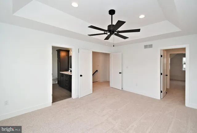 a bathroom with a tub and a window