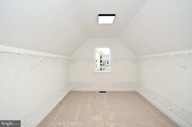 a bathroom with a double vanity sink a mirror and a bathtub