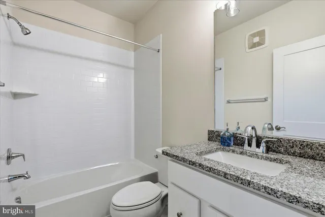 a front view of a building with many windows