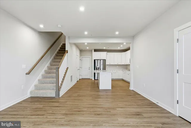 a view of entryway with wooden floor