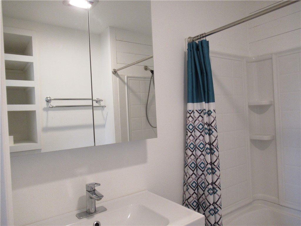 10620 D Deer Canyon Road, Unit D Jonestown, TX 78645 - Photo 6 of 22 Mirrored medicine cabinet in bath