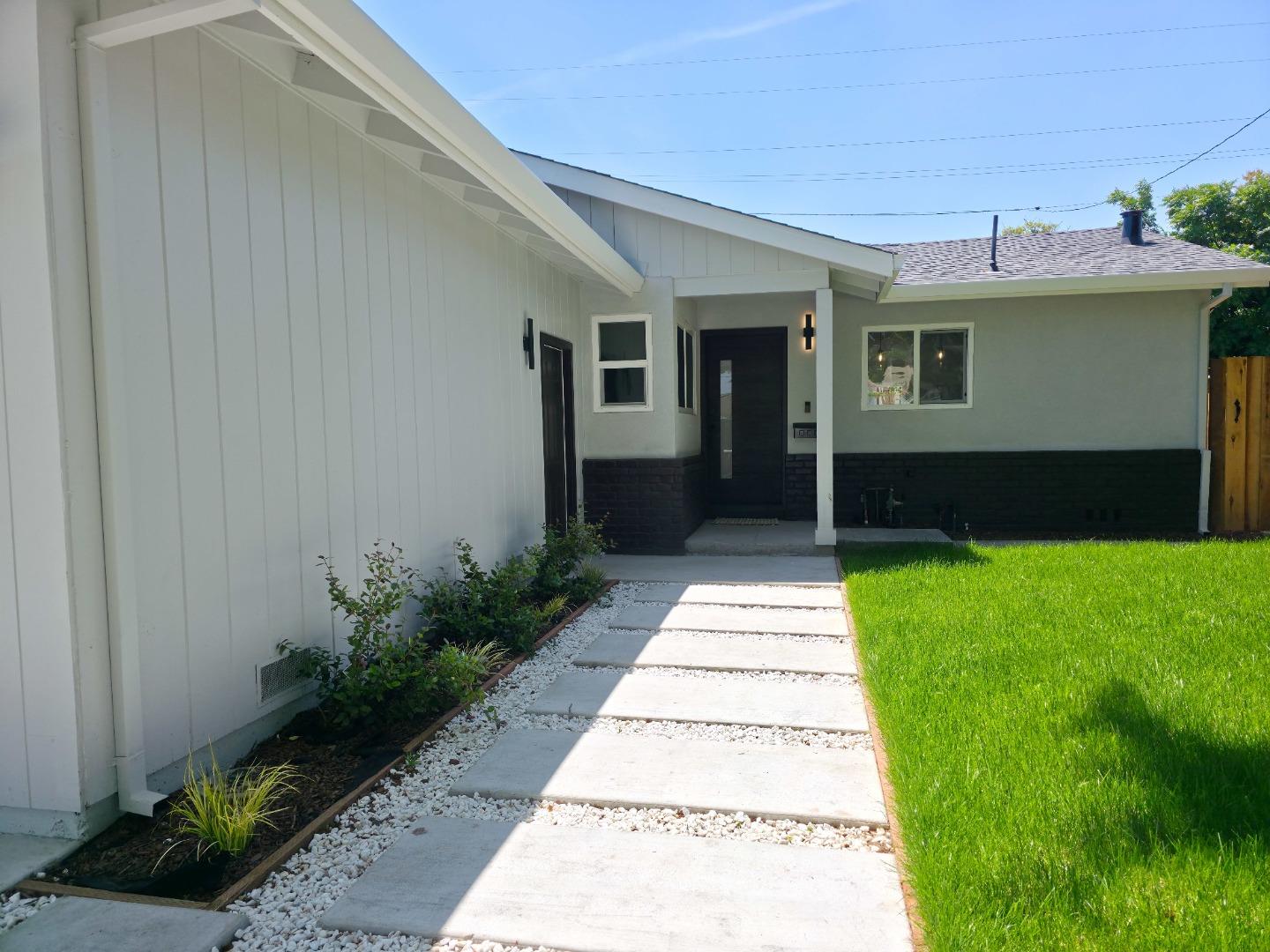 6746 Bollinger Road San Jose, CA 95129 - Photo 3 of 30 a front view of a house with a garden