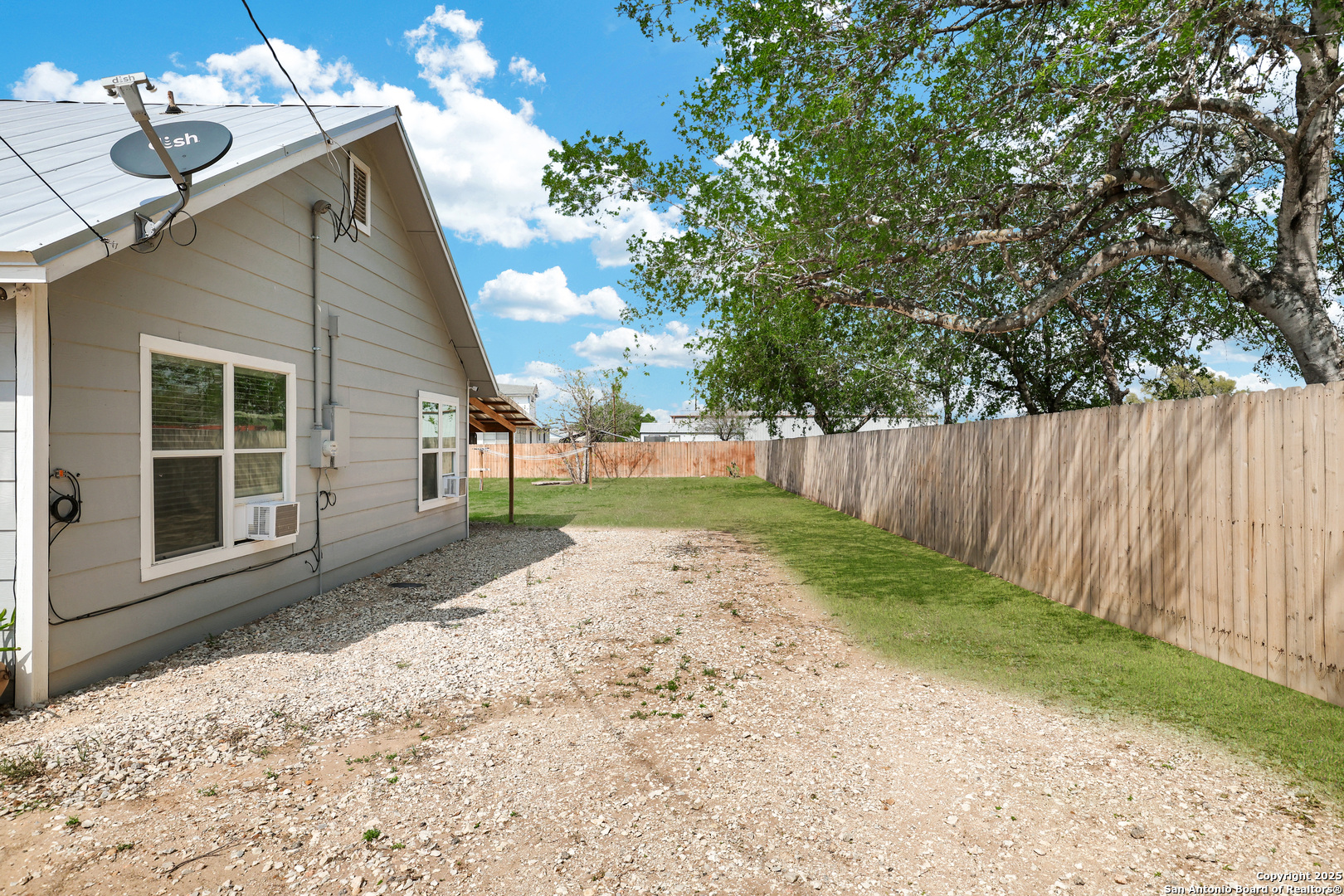 507 Hayden Avenue Devine, TX 78016 - Photo 25 of 26 a view of backyard with green space