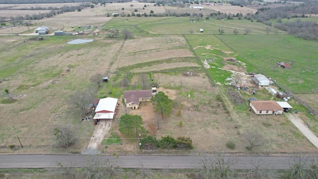 4149 County Road 4510 Commerce, TX 75428 - Photo 24 of 27 an aerial view of a house with a yard basket ball court