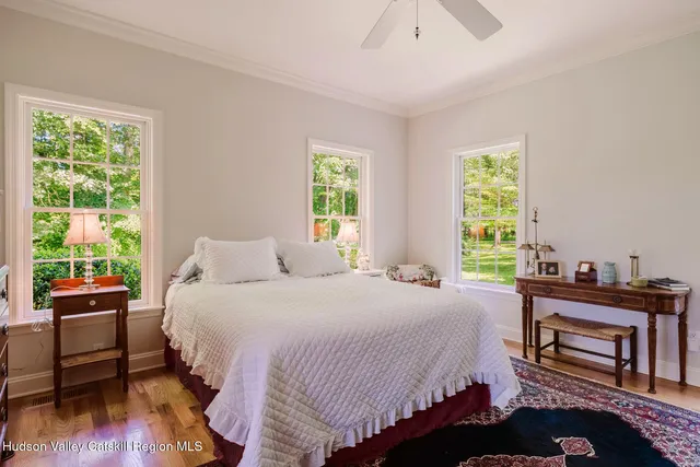 a bathroom with a bathtub sink and mirror