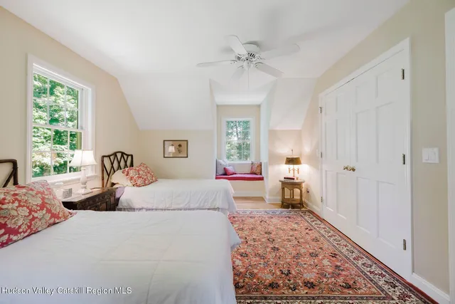 a bedroom with a bed and a table in it