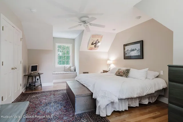 a bathroom with a sink mirror and toilet