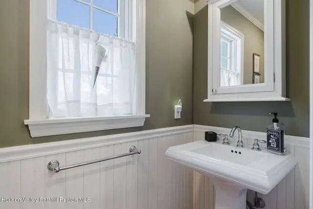 a view of a workspace with furniture and window