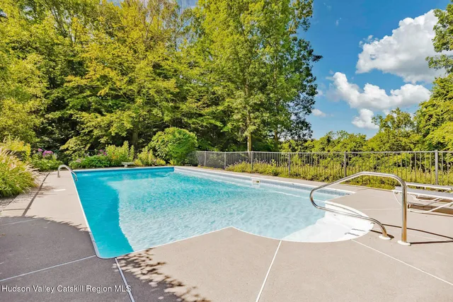 a view of yard with large trees