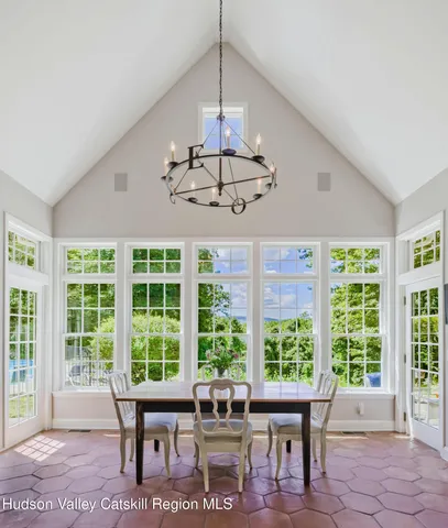 a dining room with furniture and window
