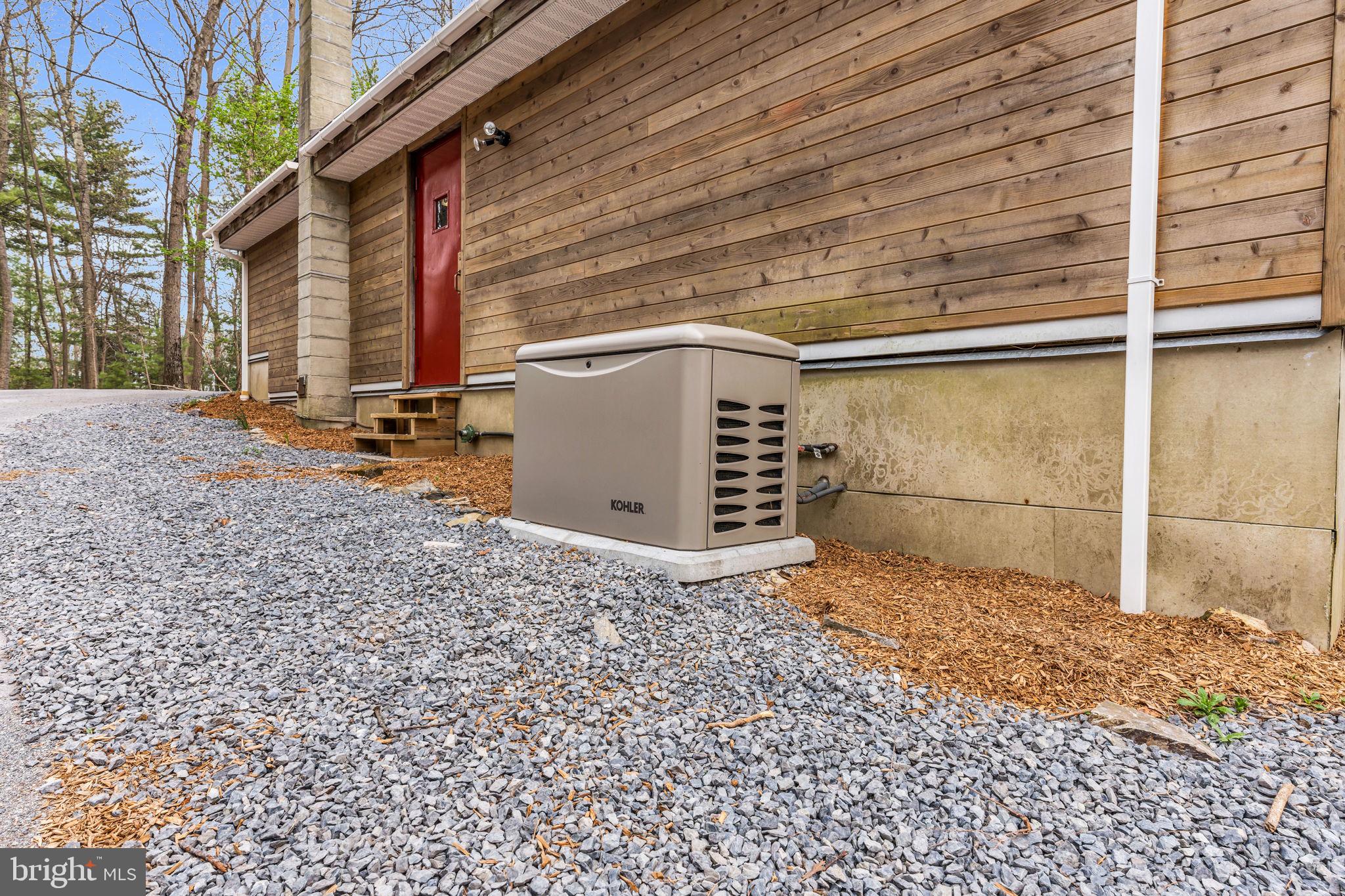 945 New Road Orrtanna, PA 17353 - Photo 5 of 58 Backup generator outside of the attached garage