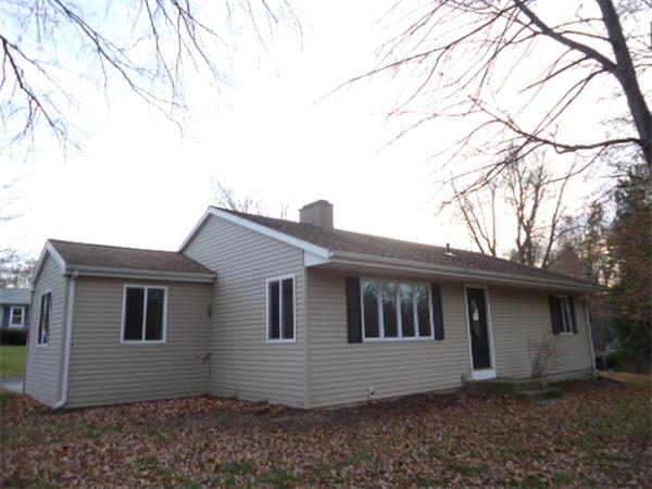 81 Crestmont Street Springfield, MA 01108 - Photo 2 of 15 a house that has a large tree in front of it