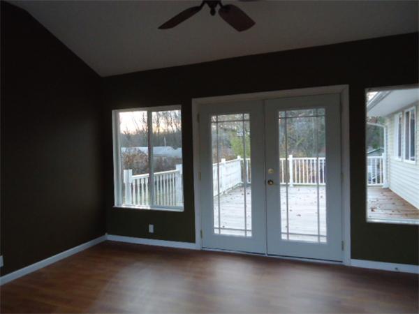 81 Crestmont Street Springfield, MA 01108 - Photo 7 of 15 a view of an empty room with wooden floor and a window