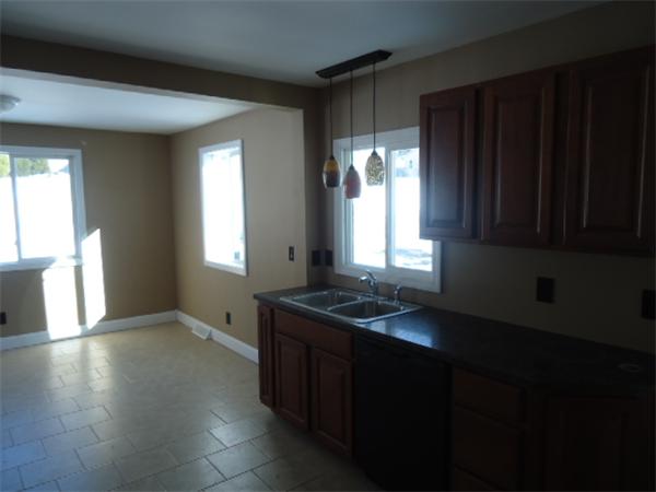 81 Crestmont Street Springfield, MA 01108 - Photo 8 of 15 a kitchen that has a sink and a window in it