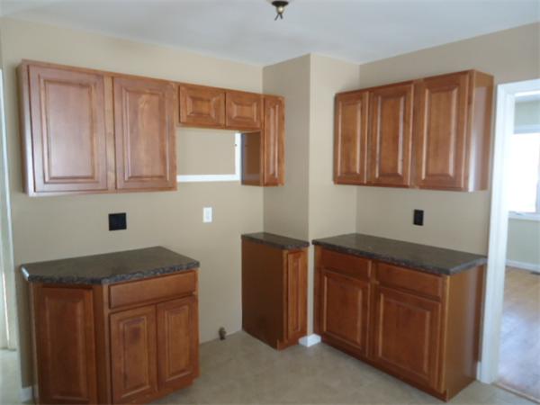 81 Crestmont Street Springfield, MA 01108 - Photo 10 of 15 a kitchen with stainless steel appliances granite countertop a sink dishwasher stove and cabinets