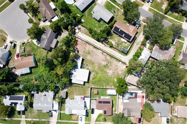 an aerial view of residential houses and street