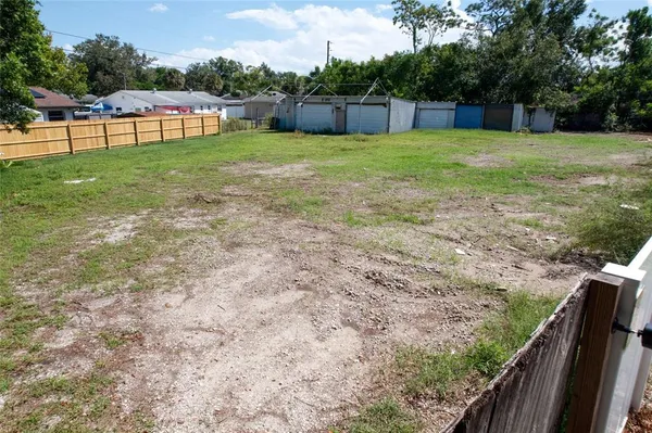 a view of a backyard with a garden and plants